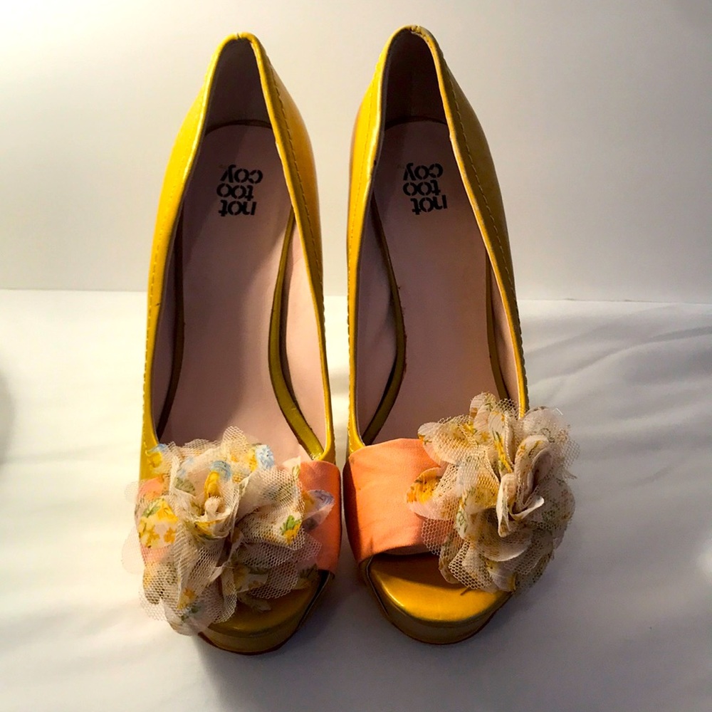 Platform heels with peach ribbon and pastel floral bow.